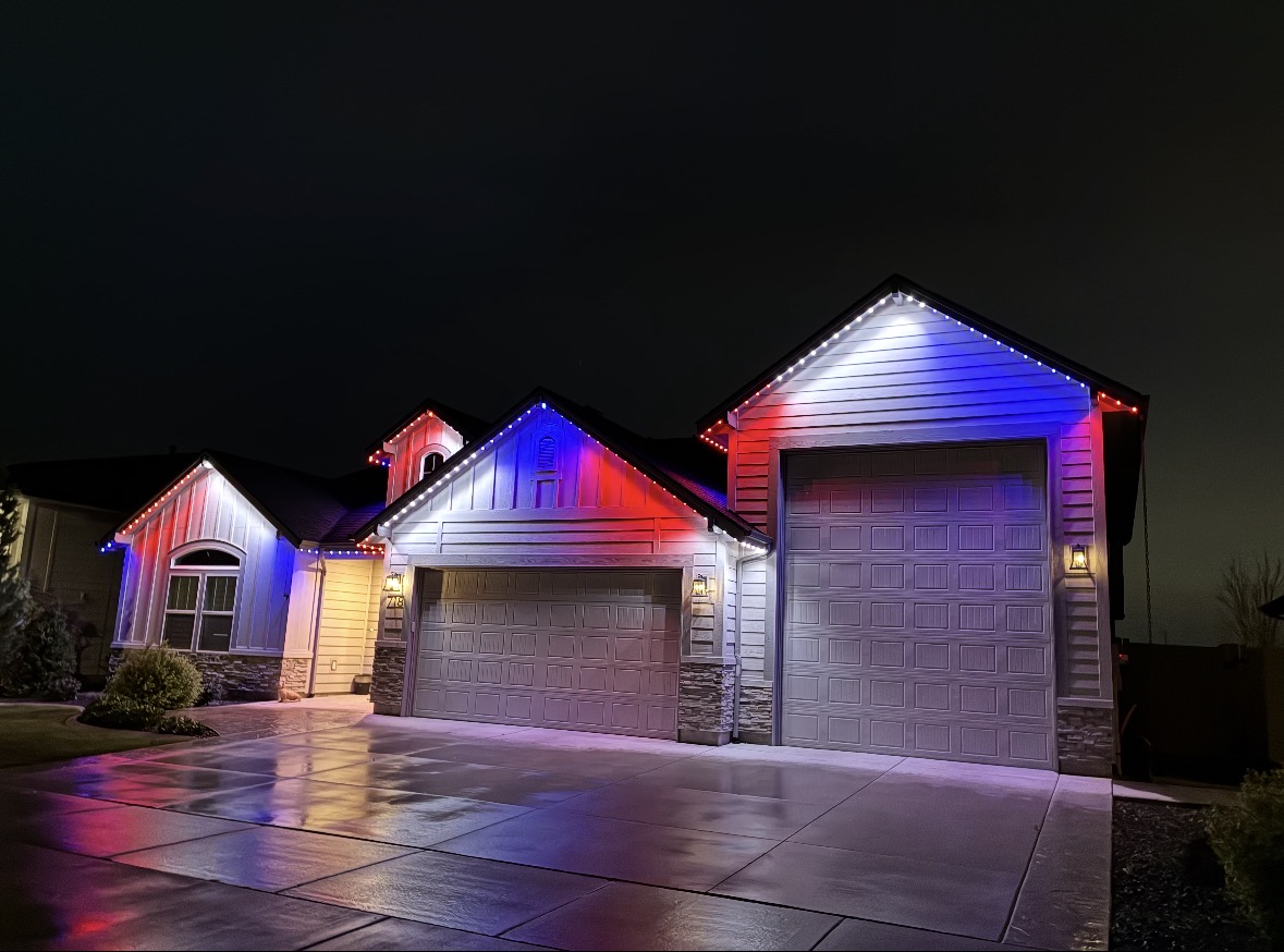 Same home lit in patriotic red, white and blue permanent LED lighting