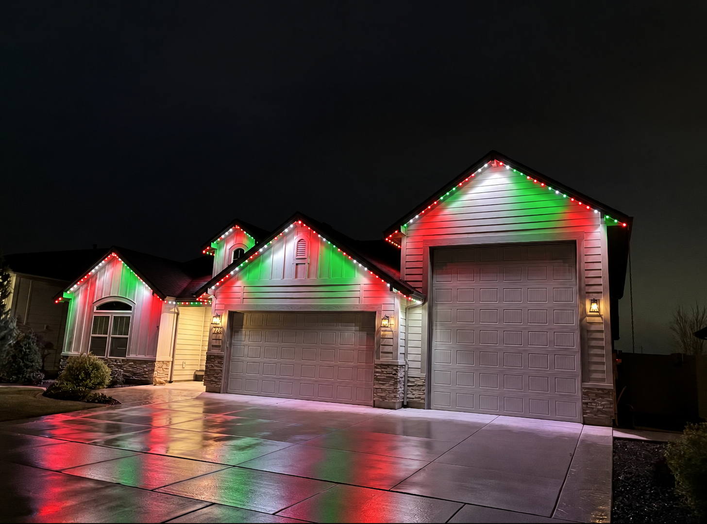 Same home lit in classic red and green permanent LED lighting